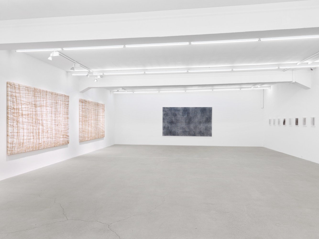 Installation view of Tim Rollins and K.O.S. paintings and text works exhibition