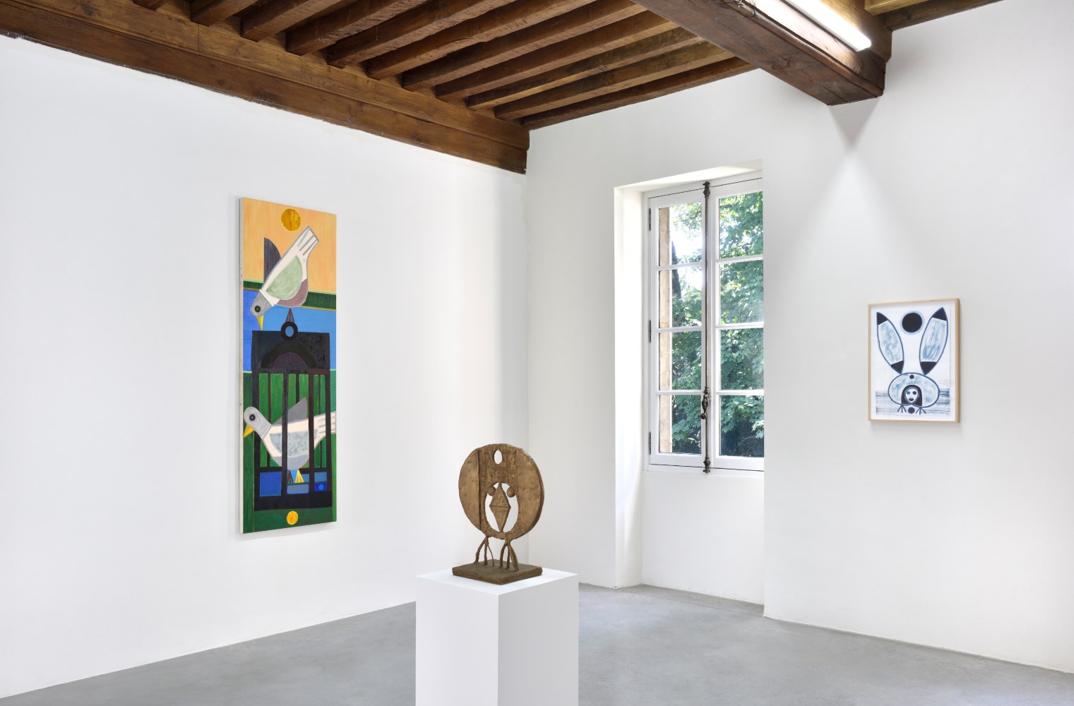 Installation view of paintings and sculptures by Austin Eddy