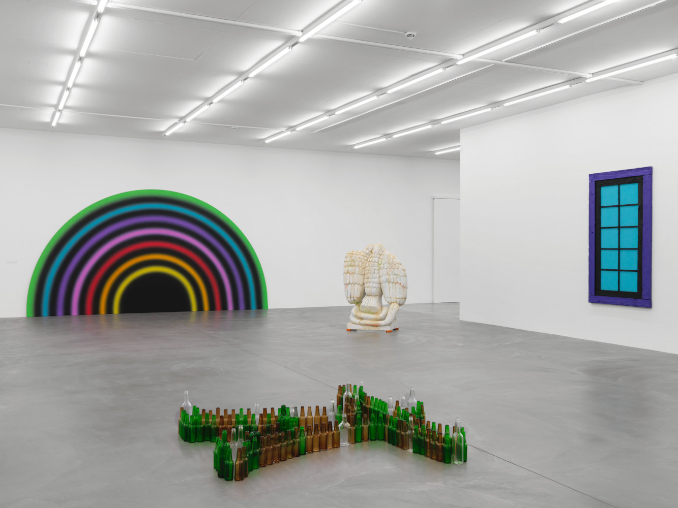 Installation view of group painting, photography, and sculpture exhibition