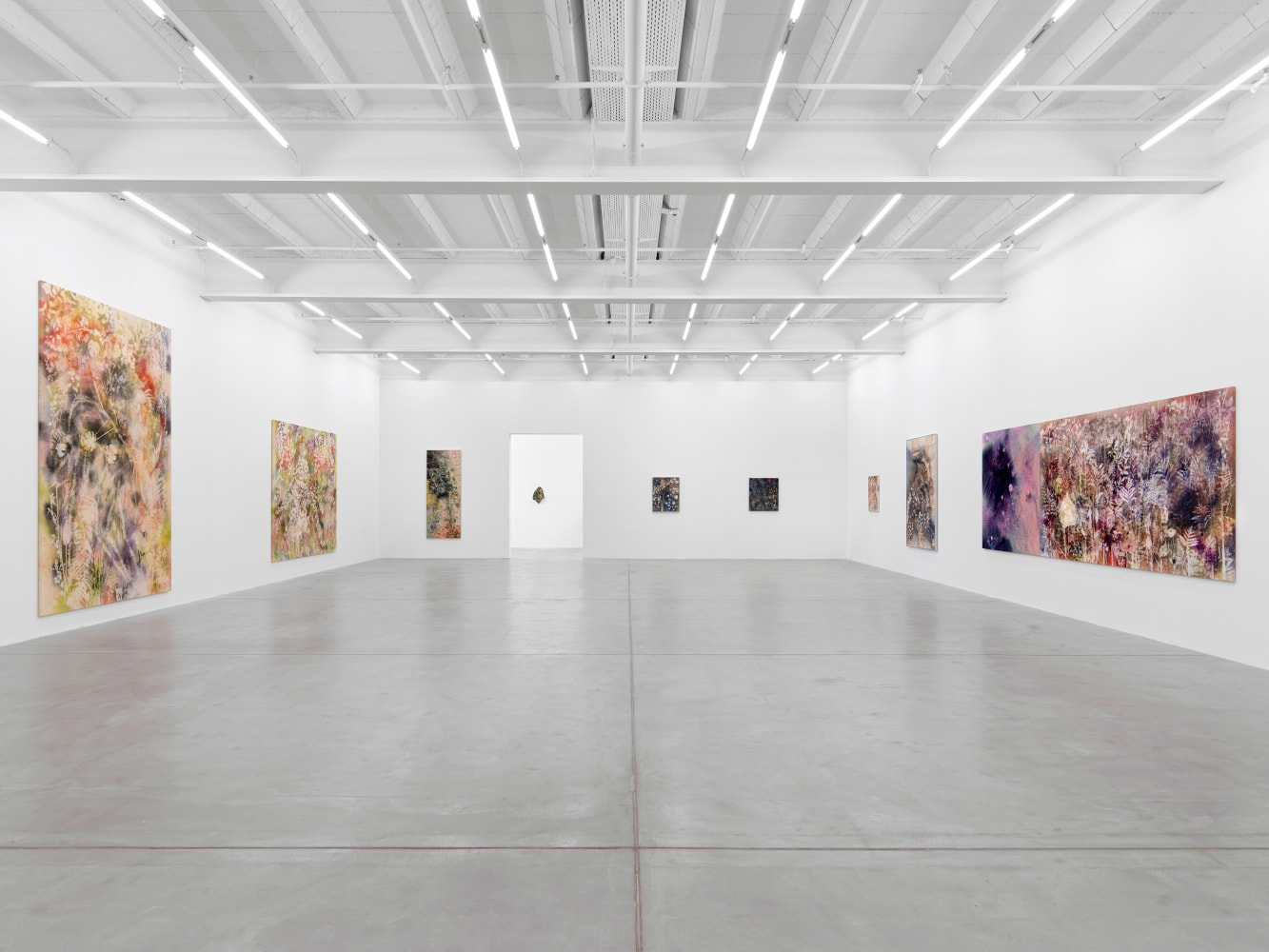 Installation view of Sam Falls paintings and ceramic reliefs exhibition