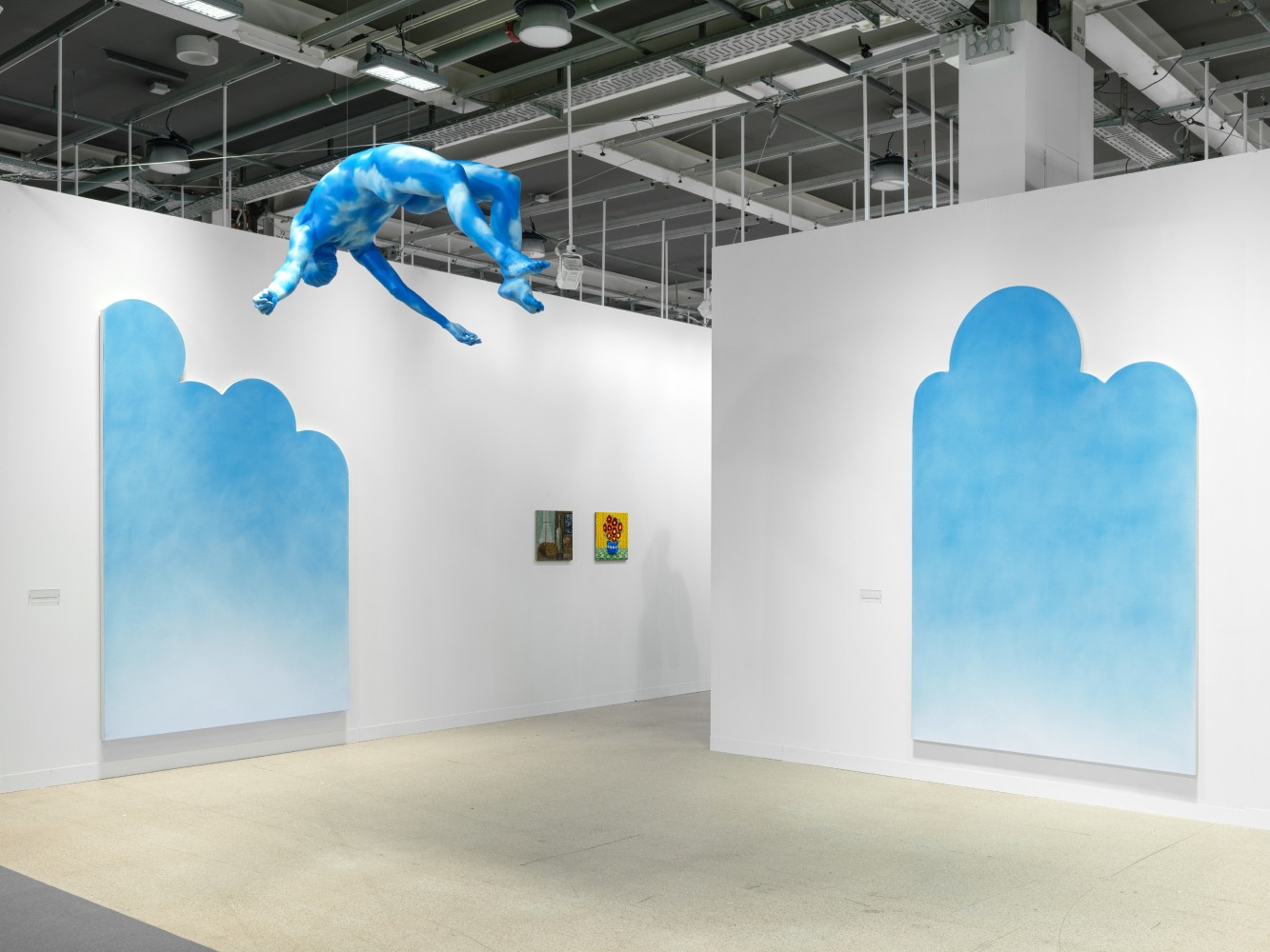 installation view of paintings and sculptures by various artists