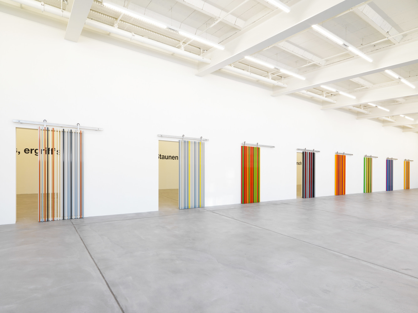 Installation view of Liam Gillick wall-based graphic works and wall hangings exhibition