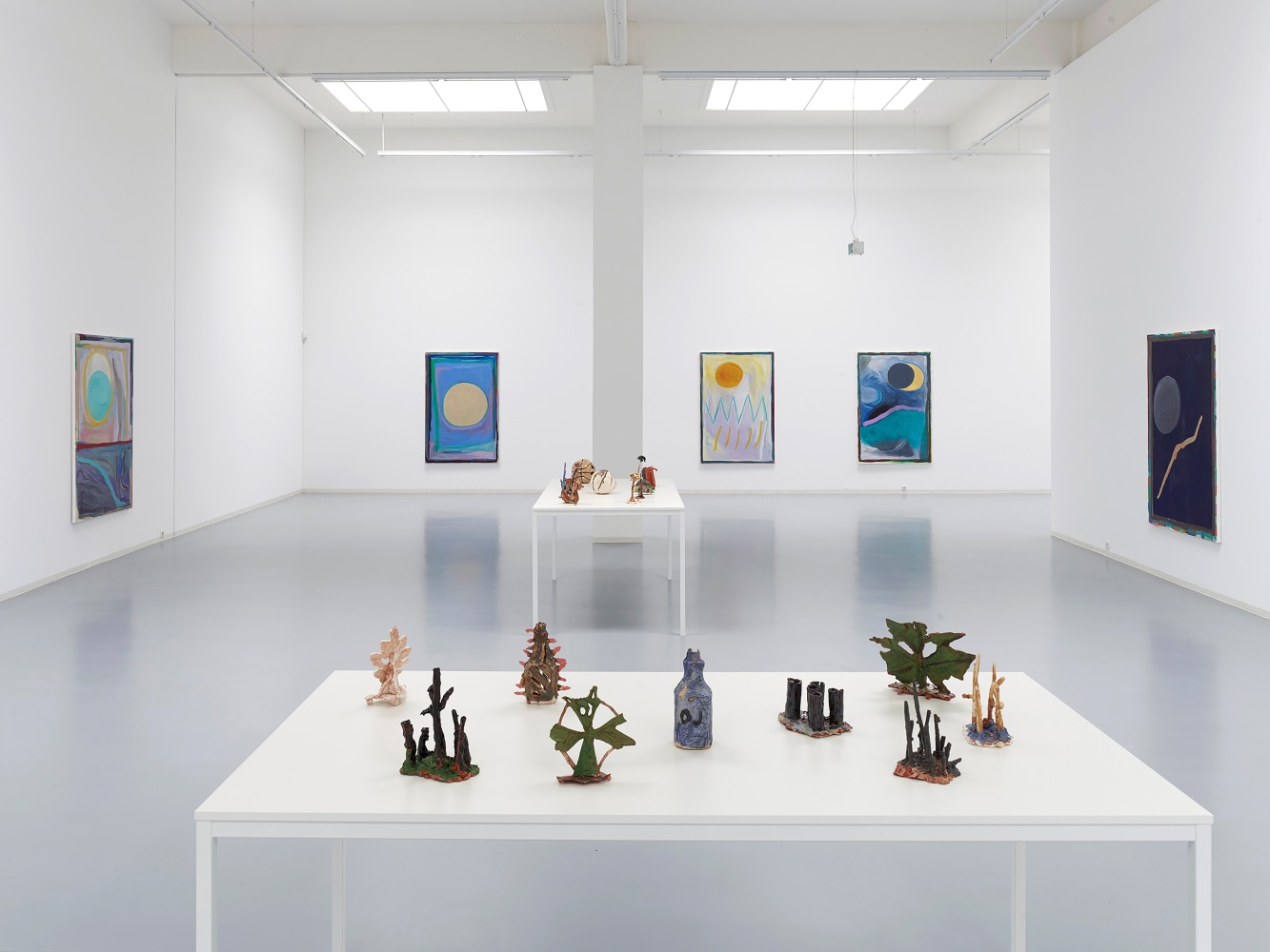 Installation view of sculptures and paintings by Josh Smith