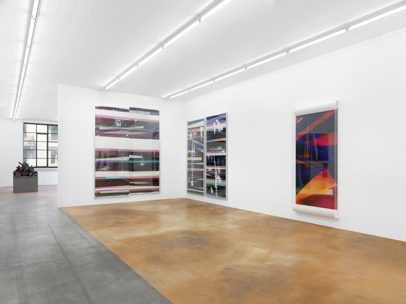 Installation view of wall works by Walead Beshty