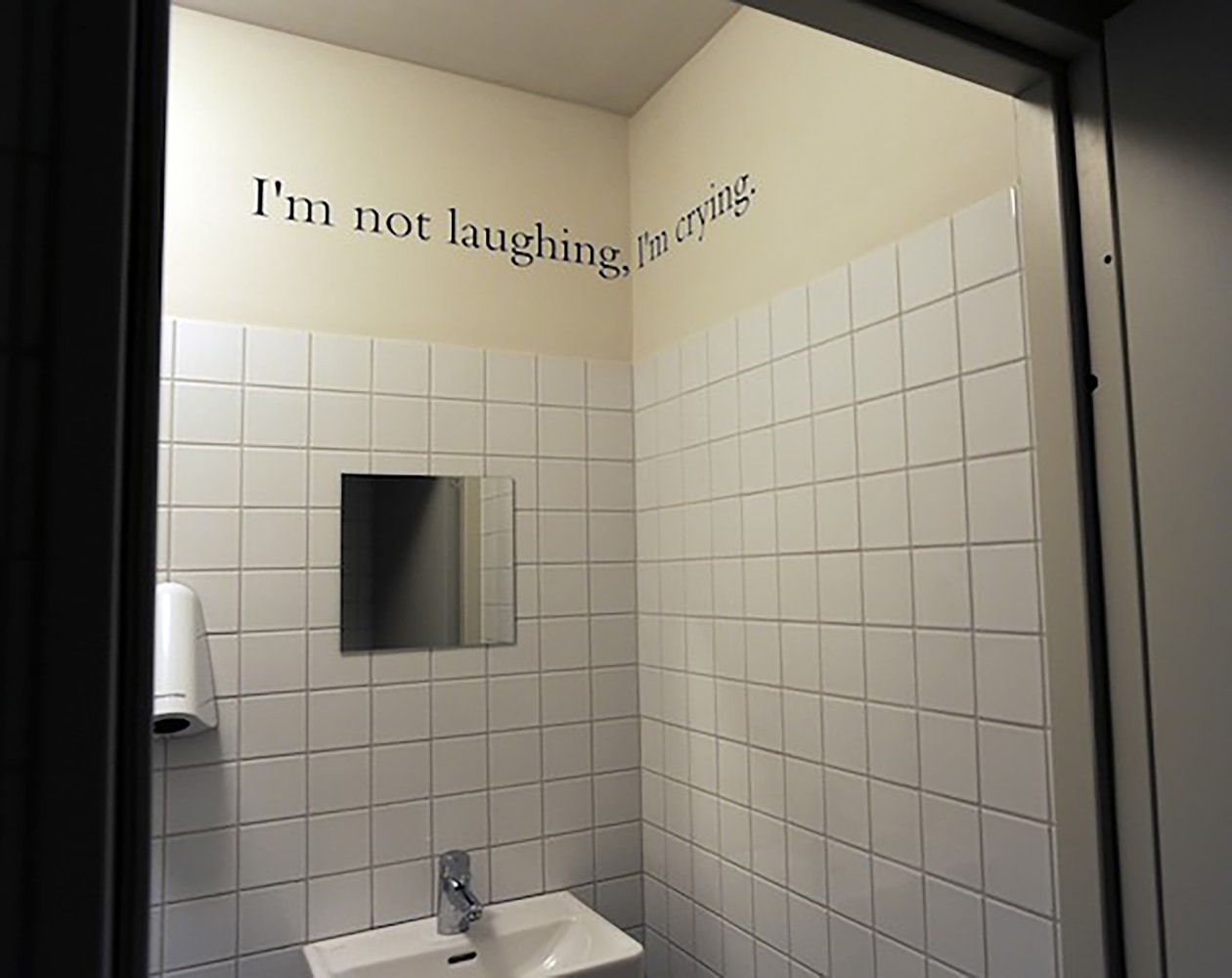 Installation view of wall quote by Douglas Gordon