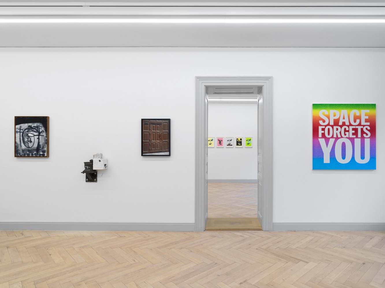 Installation view of group painting, photography, and sculpture exhibition