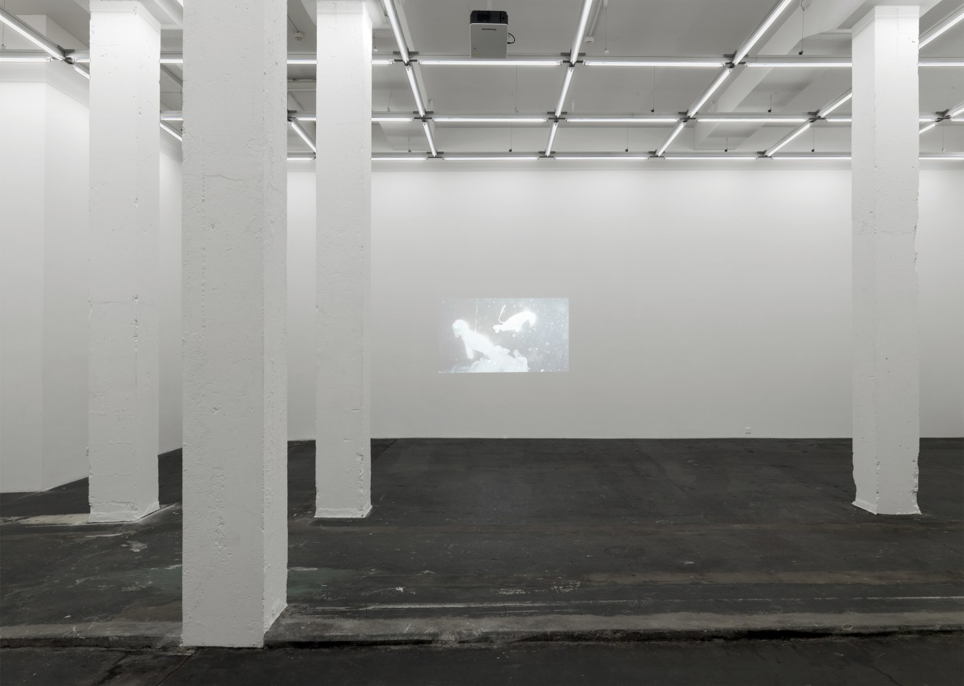 Installation view of Peter Fischli David Weiss film and sculpture exhibition