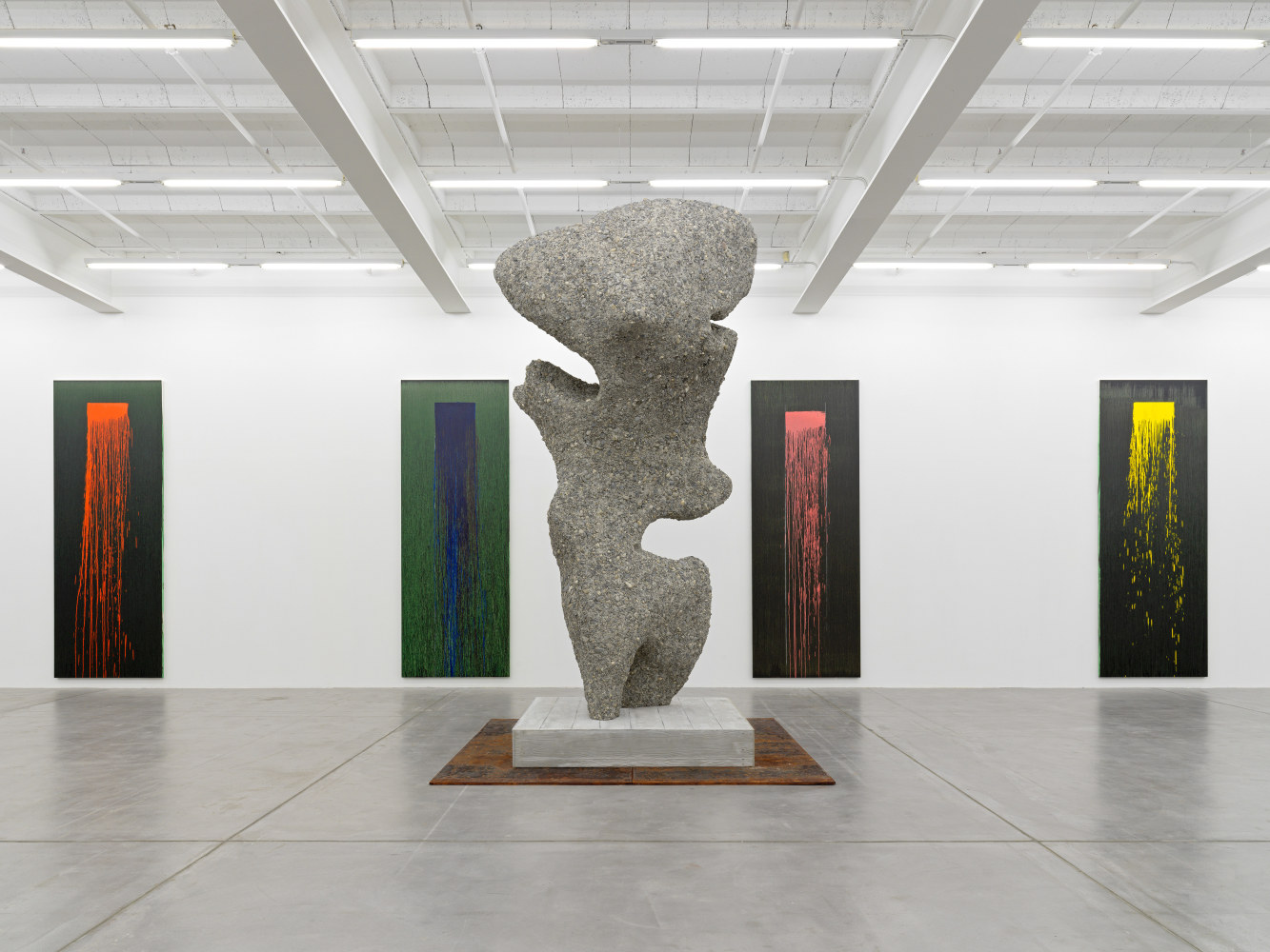 Installation view of paintings by Pat Steir and sculptures by Ugo Rondinone