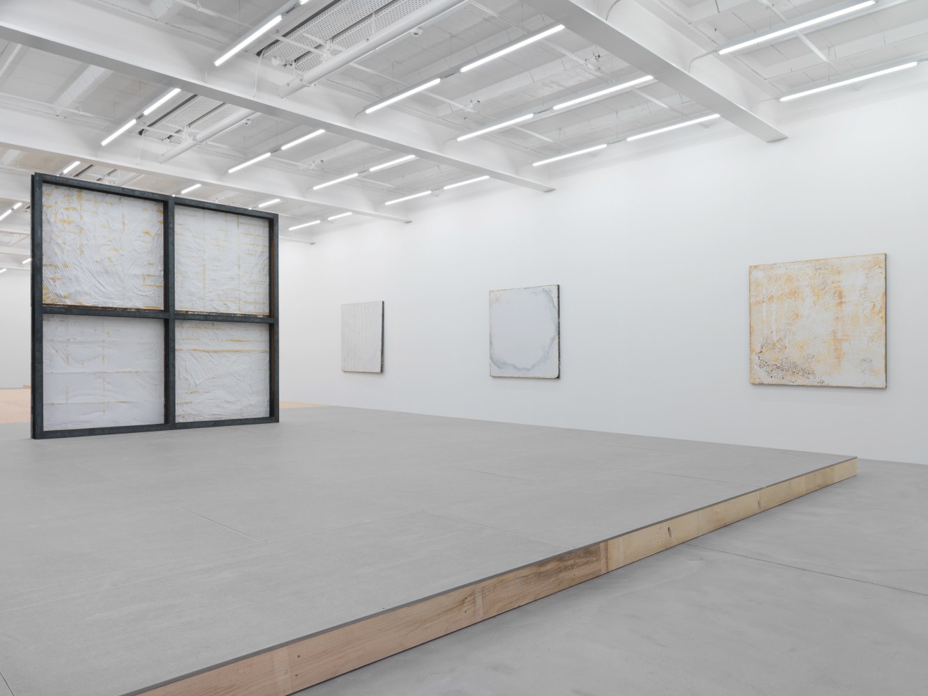 Installation view of Oscar Tuazon sculptures and floor installation exhibition