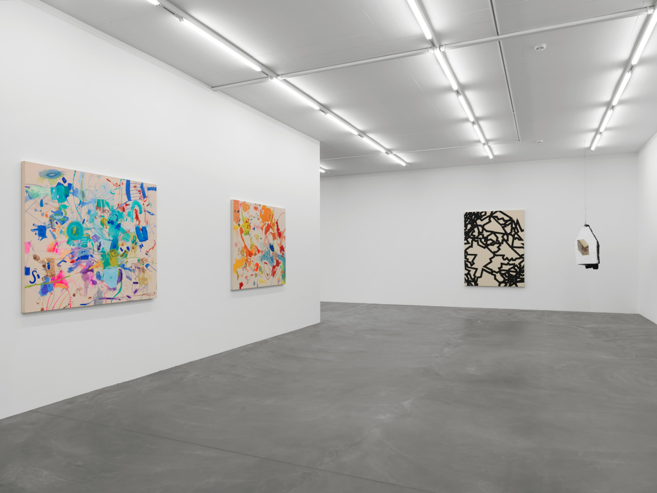 Installation view of group painting, photography, and sculpture exhibition