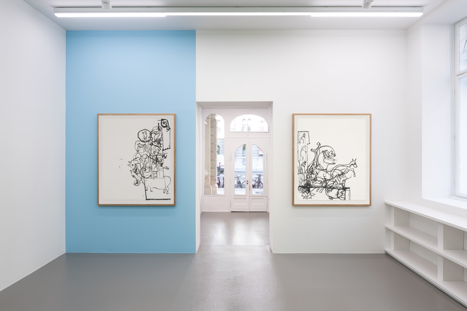 Installation view of paintings by Tobias Pils and wall paintings by Gerwald Rockenschaub