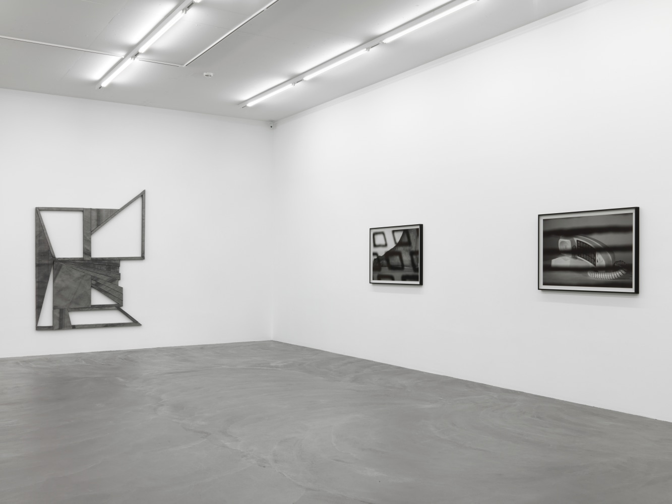 Installation view of Wyatt Kahn wall reliefs and photographs