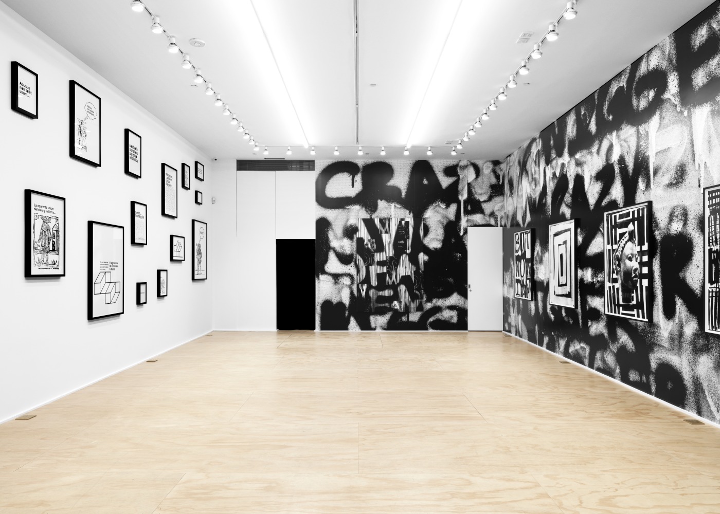 Installation view of Liam Gillick and Adam Pendleton films and wall-based works