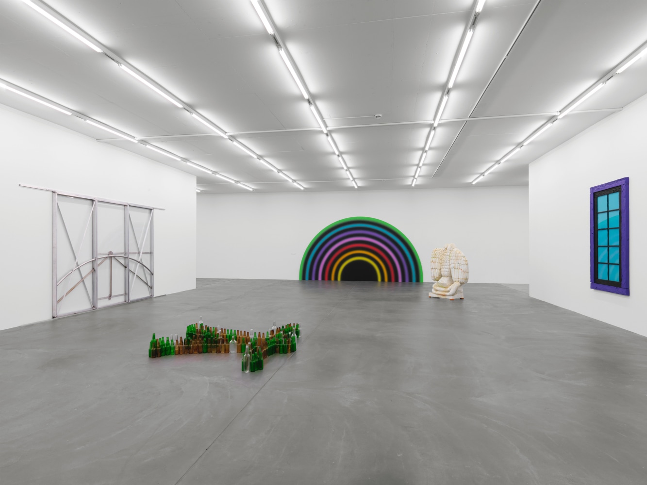 Installation view of group painting, photography, and sculpture exhibition