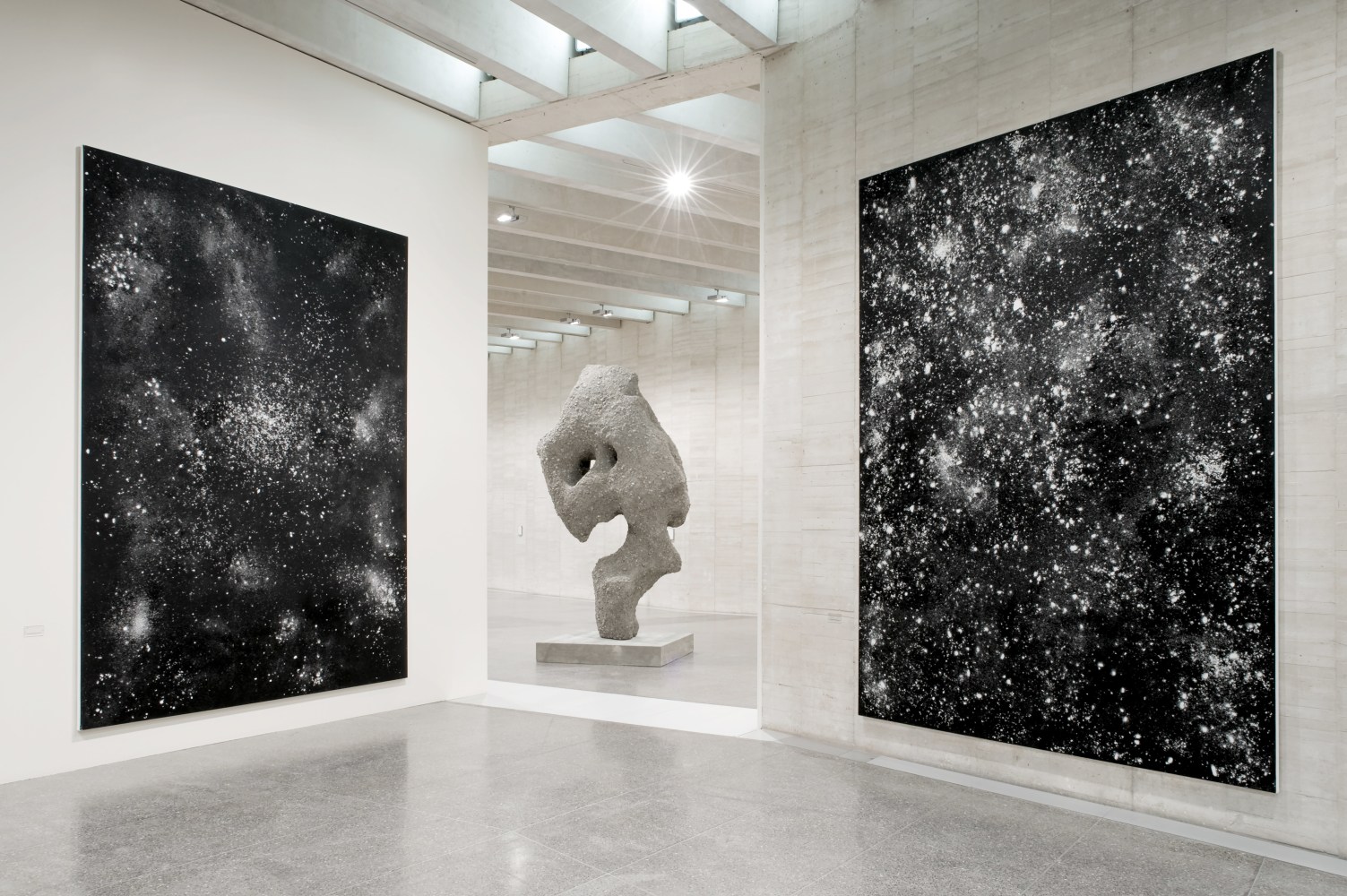 Installation view of sculpture and paintings by Ugo Rondinone