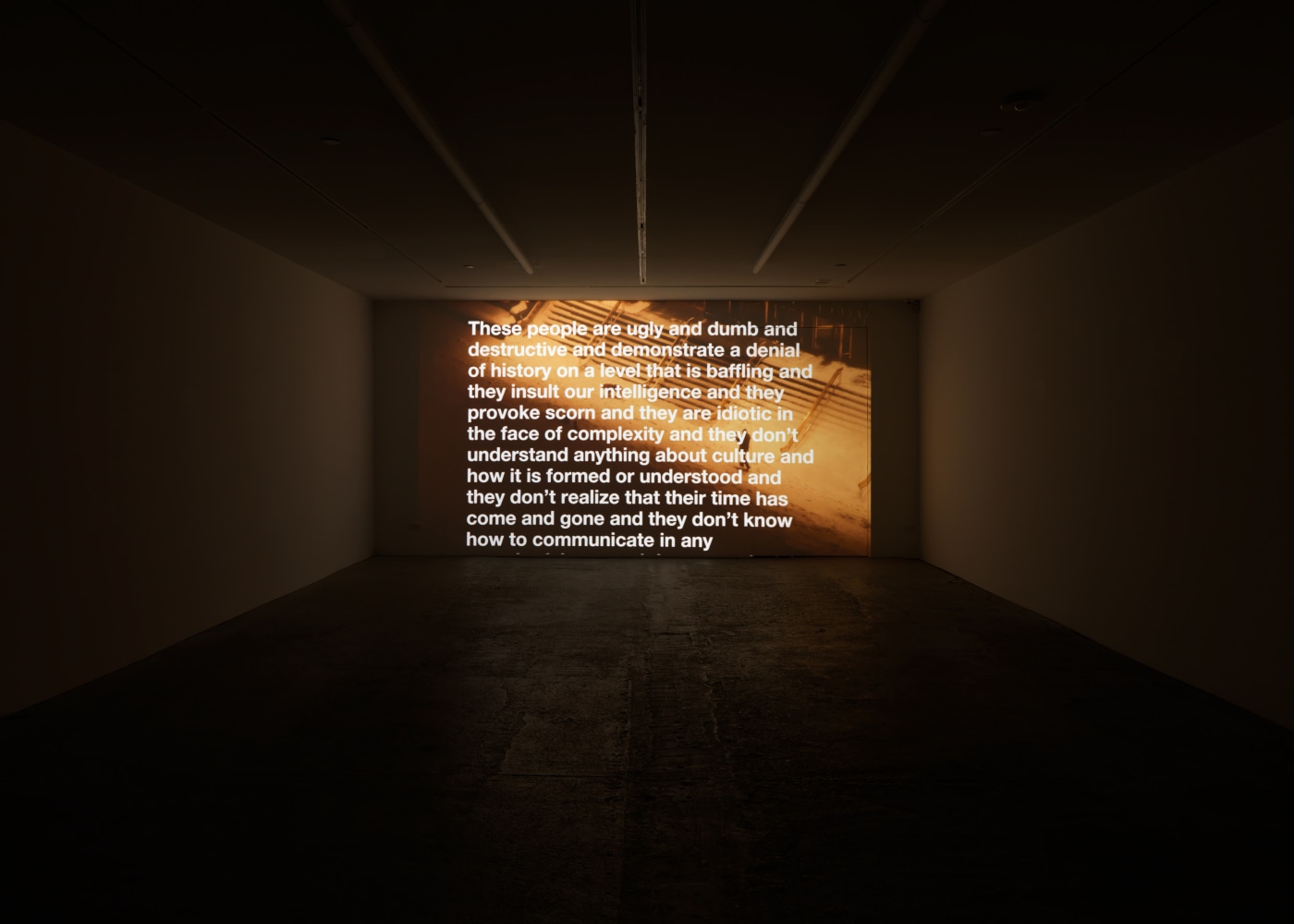 Installation view of Liam Gillick and Adam Pendleton films and wall-based works