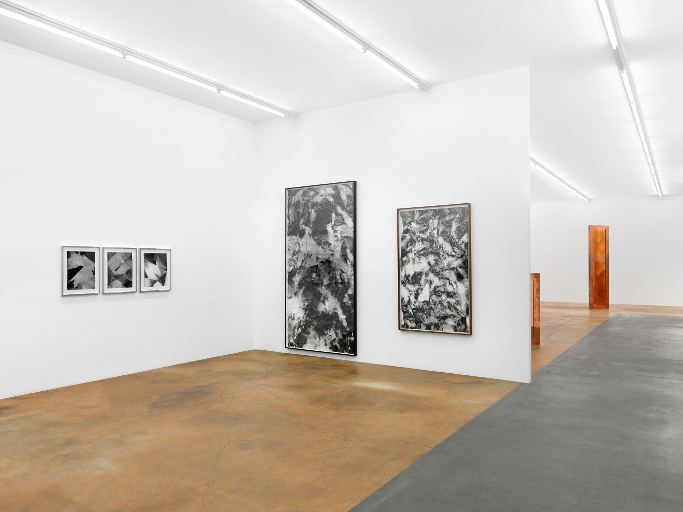 Installation view of wall works by Walead Beshty