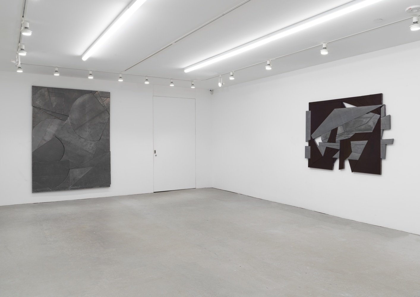 Installation view of Wyatt Kahn wall reliefs and works on paper