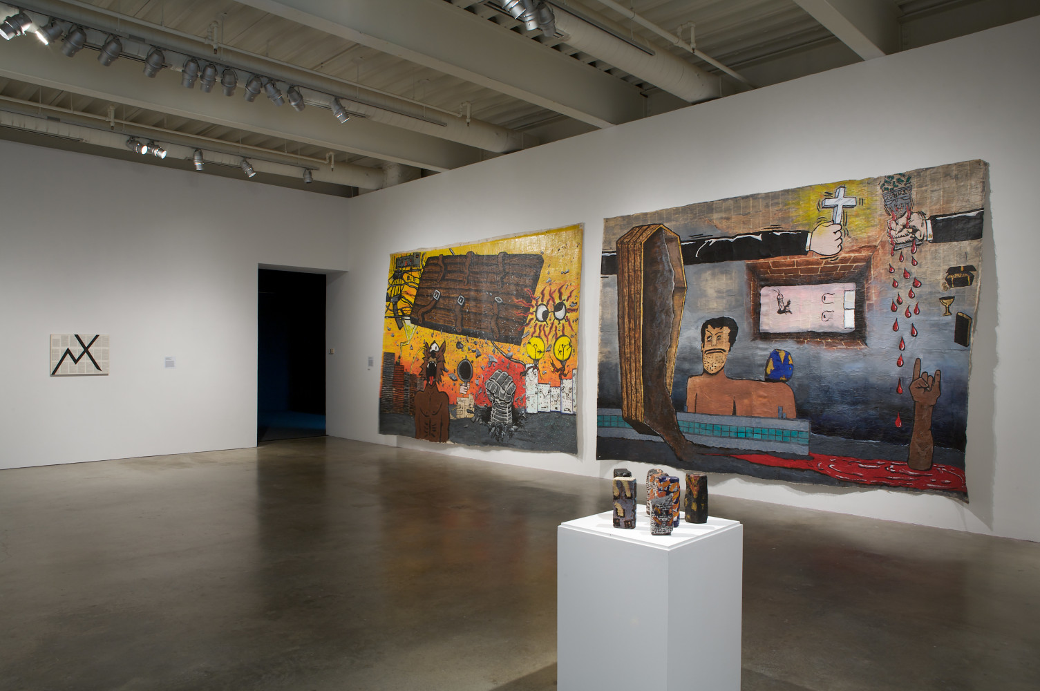 Installation view of paintings by Tim Rollins and K.O.S.