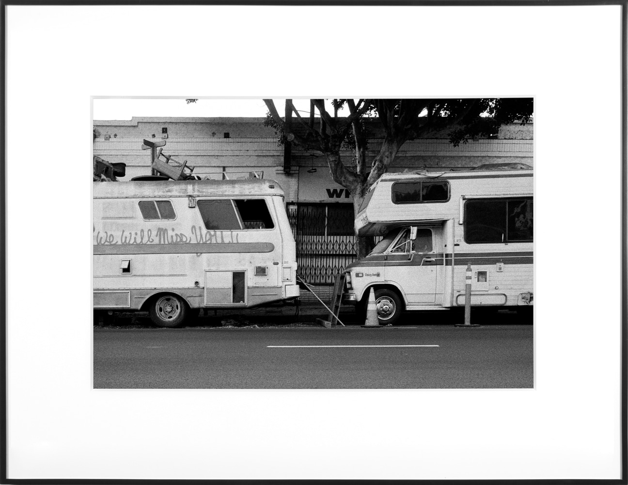 (Temporary) Homes for America: 3300 block to 4400 block, Union Pacific Avenue, between South Grande Vista Avenue and South Marianna Avenue, Los Angeles/Commerce, California, December 2020
2021
Black and white fiber print
Ed. 1/1 + 1 AP
Sheet 20.5 x 30.5 cm / 8 x 12 inches

BESHT48009