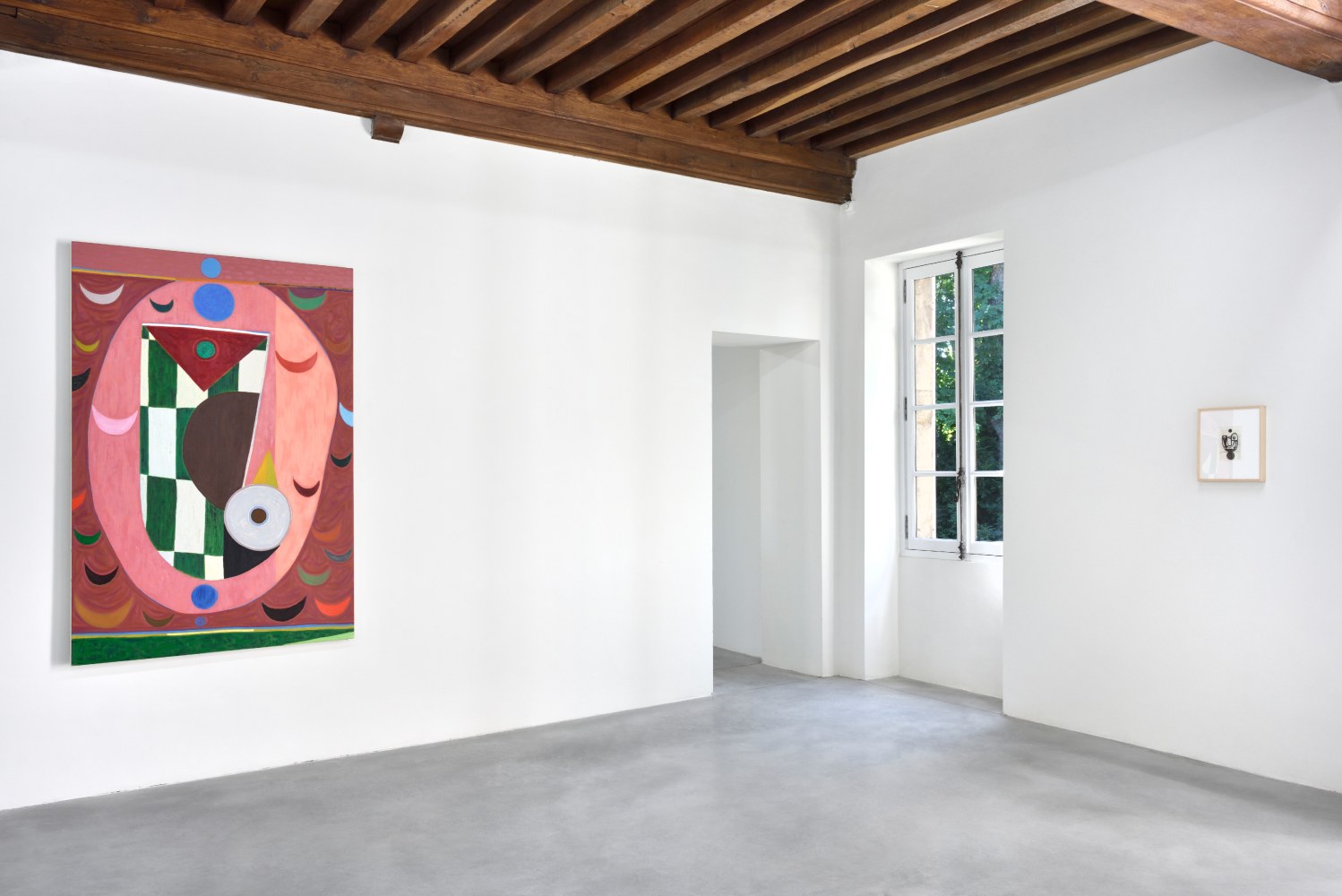 Installation view of paintings and sculptures by Austin Eddy