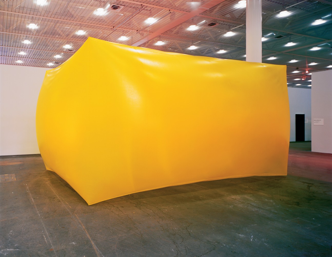 Installation by Gerwald Rockenschaub, Untitled 2000 Inflatable object, yellow PVC-foil, electric blower 350 x 500 x 700 cm Installation view, Art Unlimited, Art Basel, Basel, 2001 © Gerwald Rockenschaub