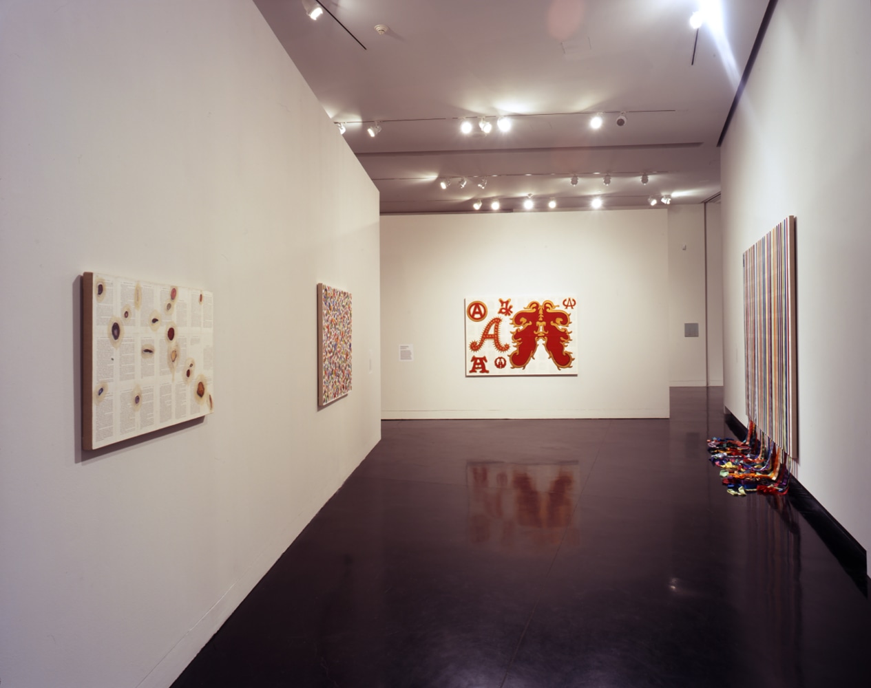 Installation view of paintings by Tim Rollins and K.O.S.