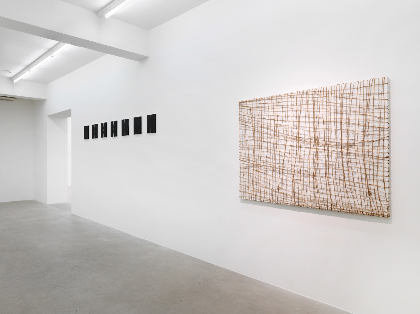 Installation view of Tim Rollins and K.O.S. paintings and text works exhibition