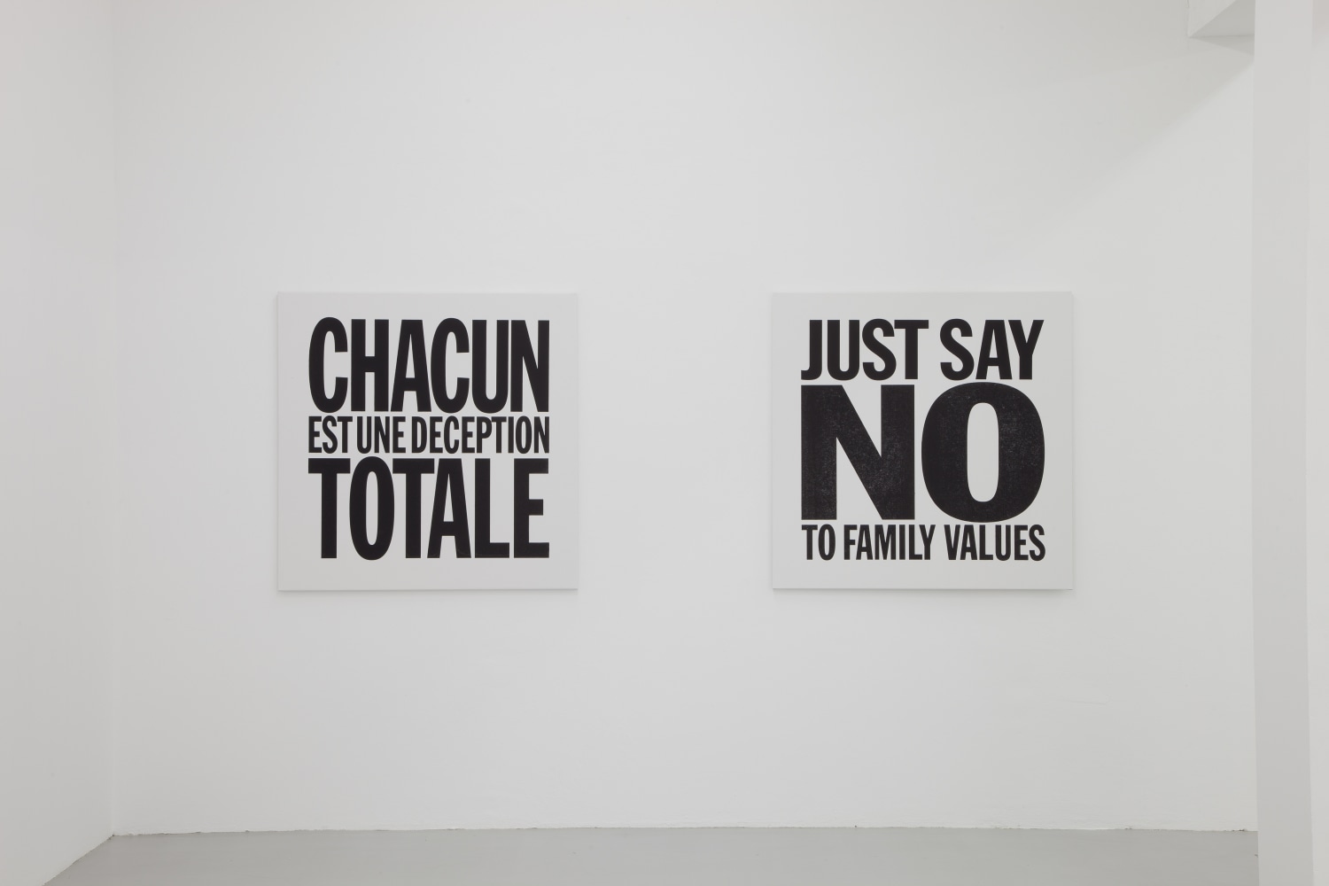 Installation view of wall works by John Giorno