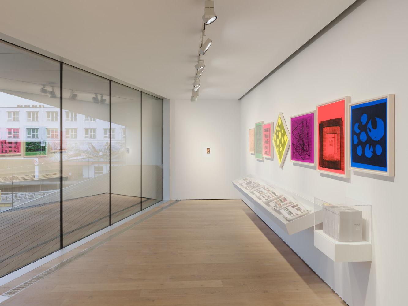 Installation view of sculptures, screen prints, paintings and drawings by Steven Shearer