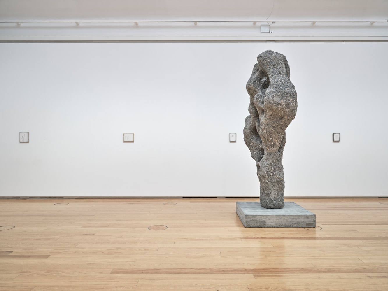 Installation view of paintings and sculptures by Ugo Rondinone