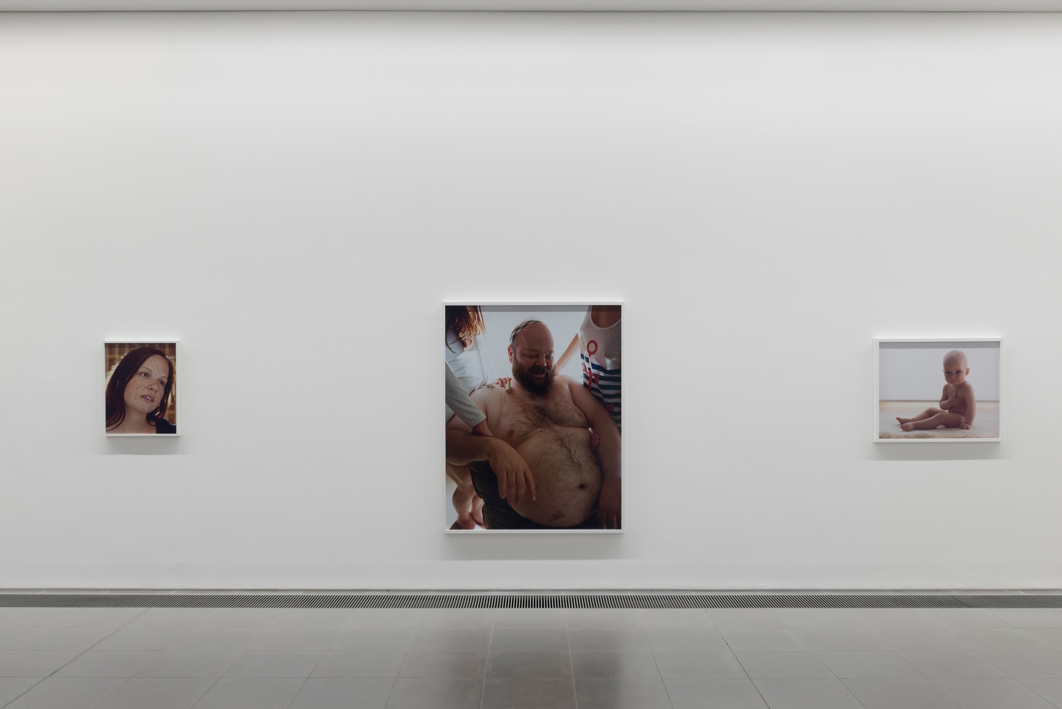 Installation view of photographs by Torbjørn Rødland