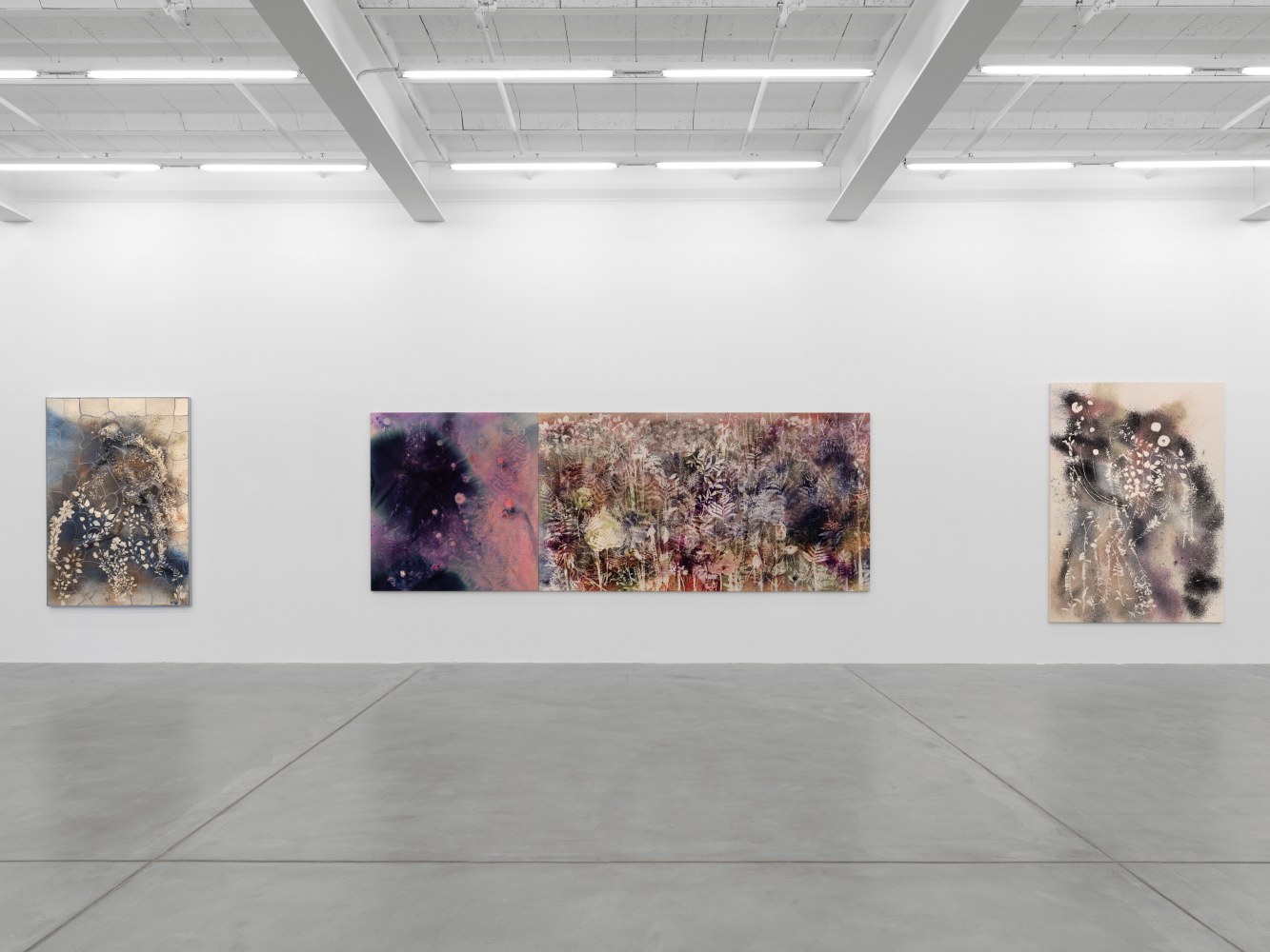 Installation view of Sam Falls paintings and ceramic reliefs exhibition