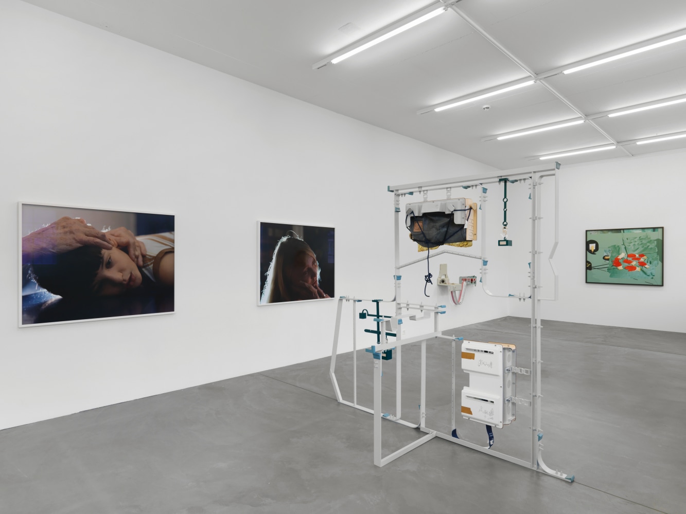 Installation view of group painting, photography, and sculpture exhibition