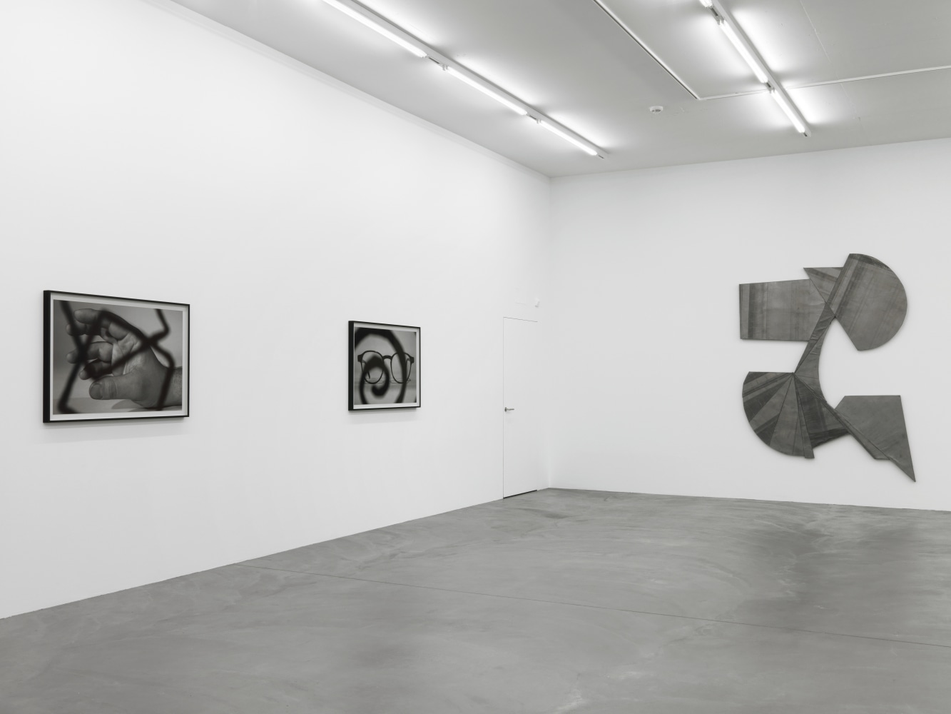 Installation view of Wyatt Kahn wall reliefs and photographs