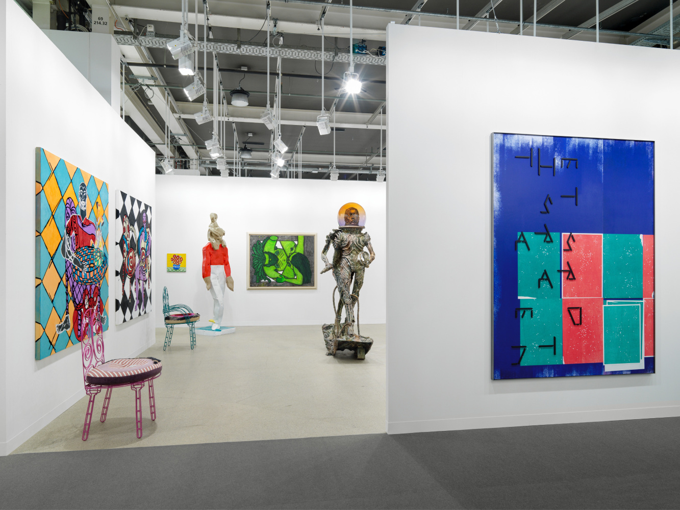 installation view of paintings and sculptures by various artists