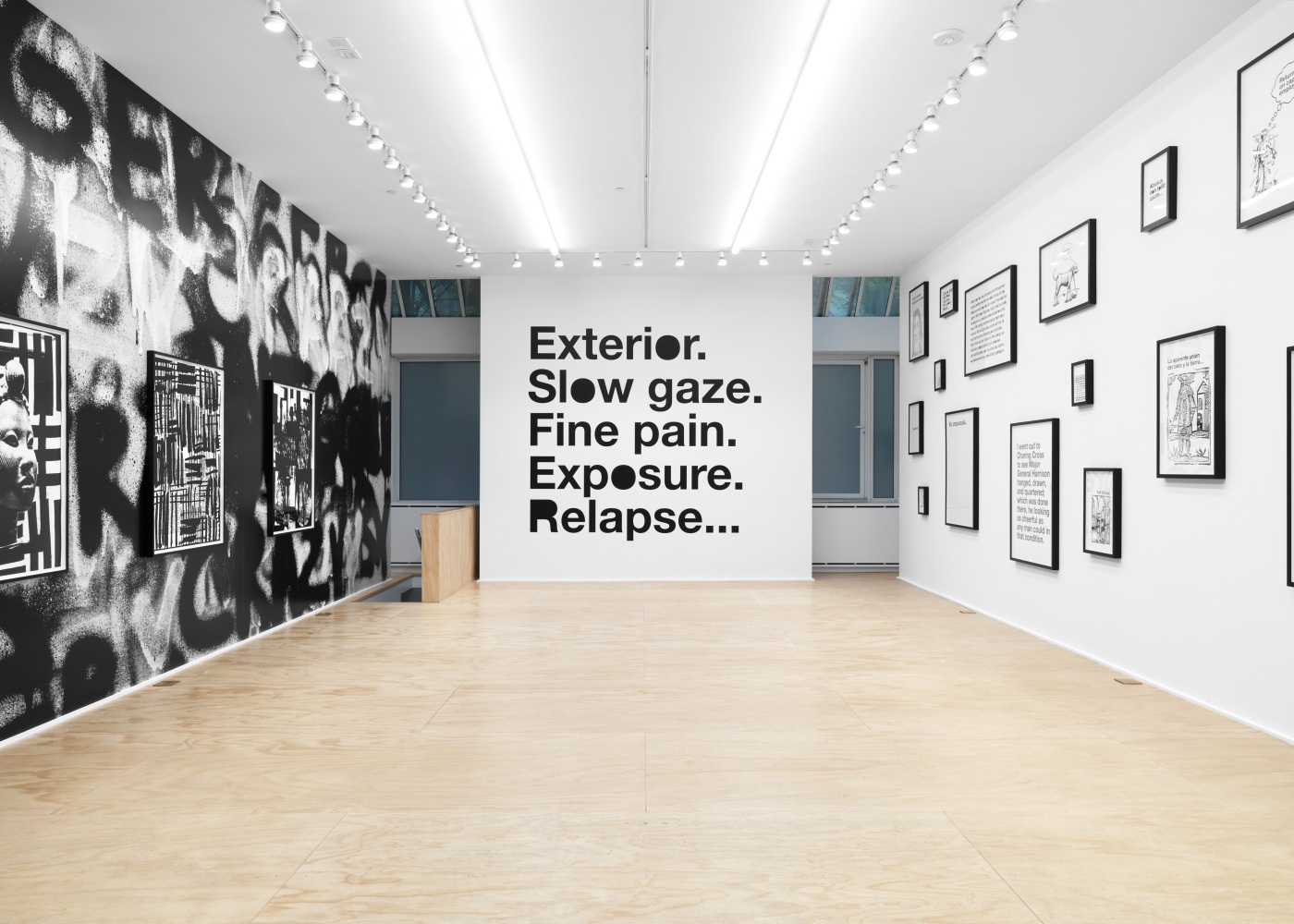 Installation view of Liam Gillick and Adam Pendleton films and wall-based works