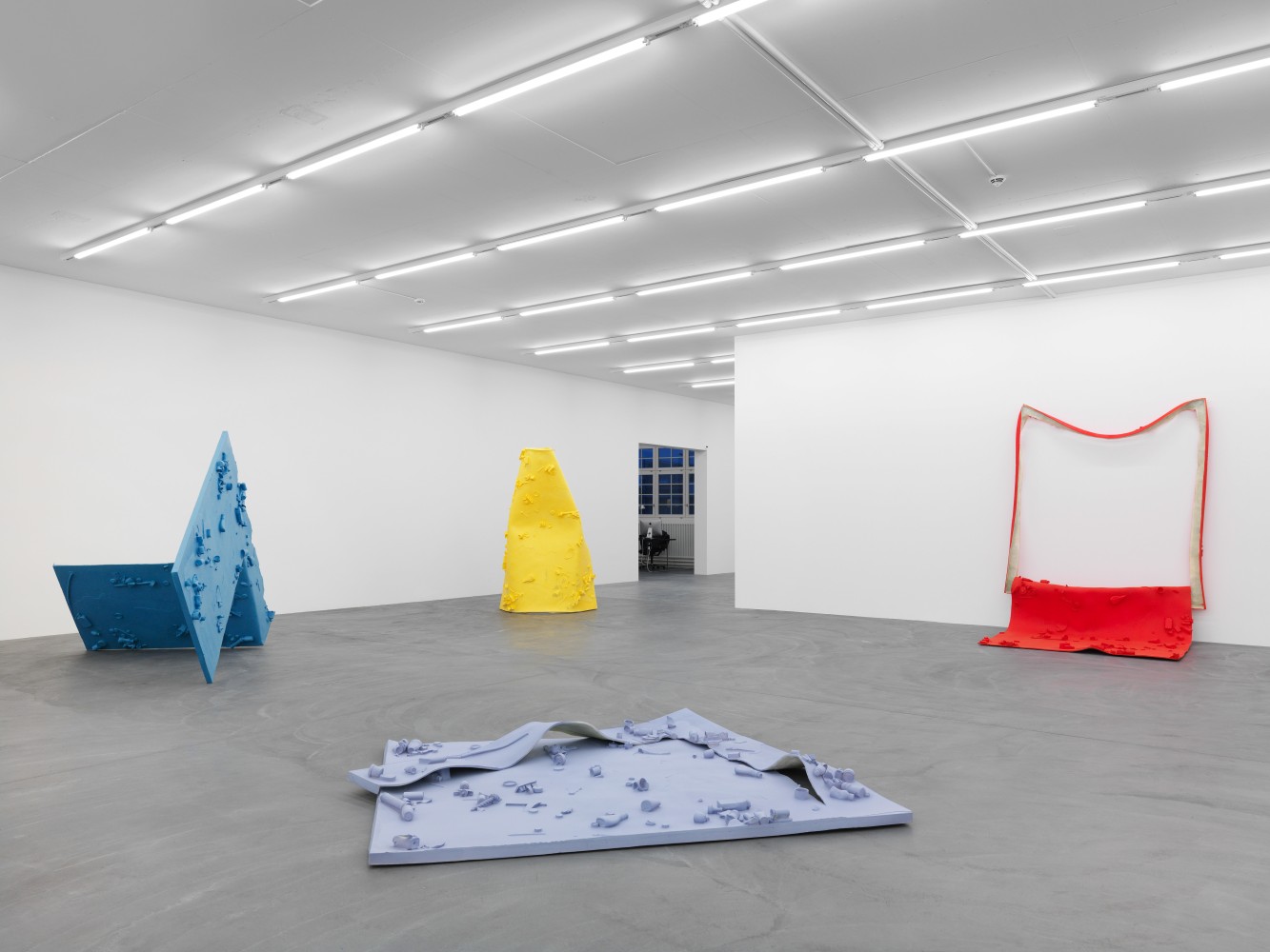 Installation view of Alex Hubbard sculptural paintings and film exhibition