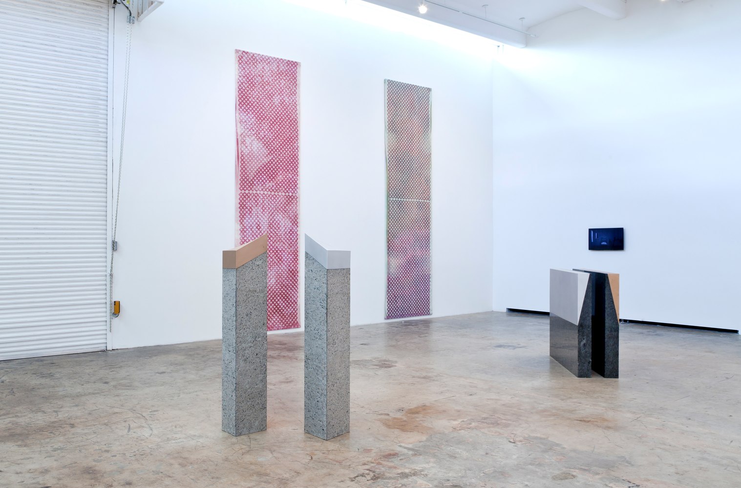 Installation view of paintings and sculptures by Sam Falls