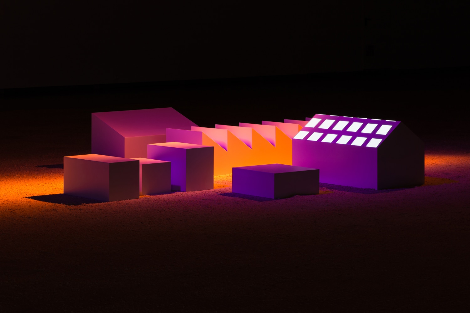 Installation by Liam Gilllick, The Light is no Brighter at the Centre 2017 Painted MDF, theatre lights, HD projection, sawdust 9:21 min Installation dimensions variable