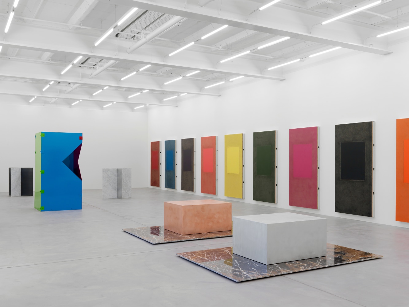 Installation view of Sam Falls paintings and sculptures exhibition