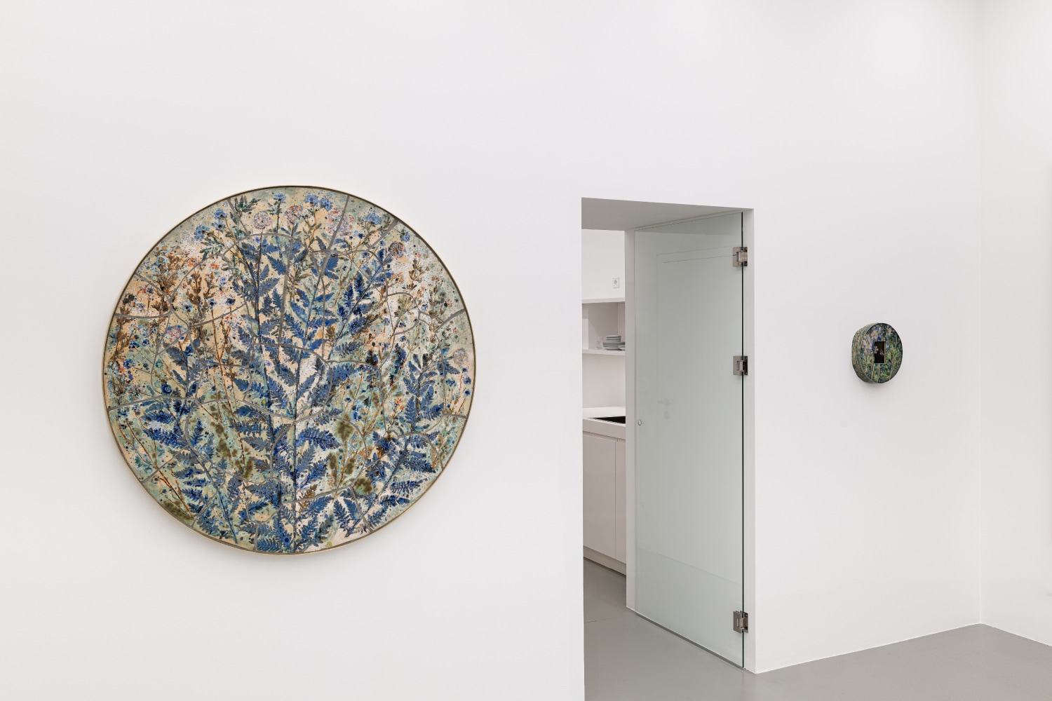 installation views of paintings and ceramic works by Sam Falls