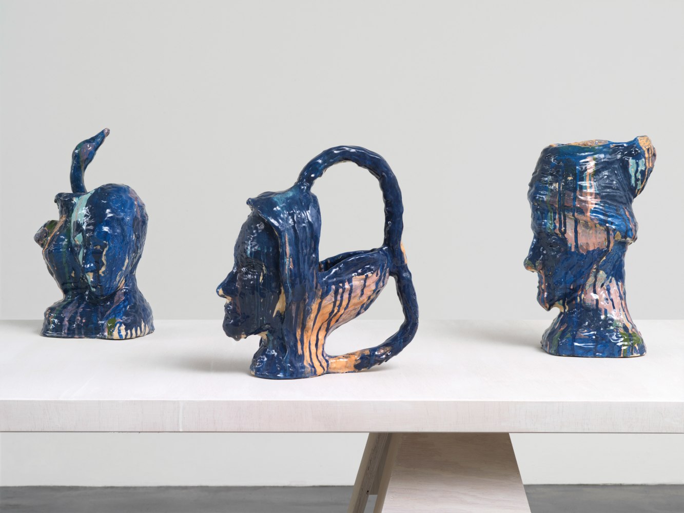 Group of sculptures by Andrew Lord on table