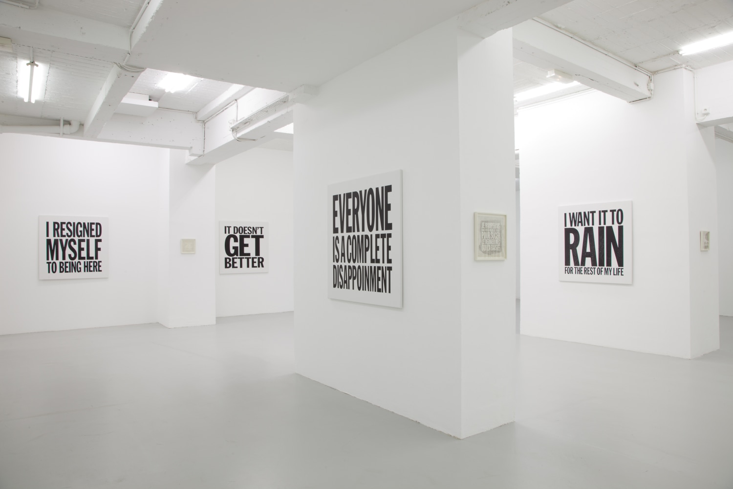Installation view of wall works by John Giorno