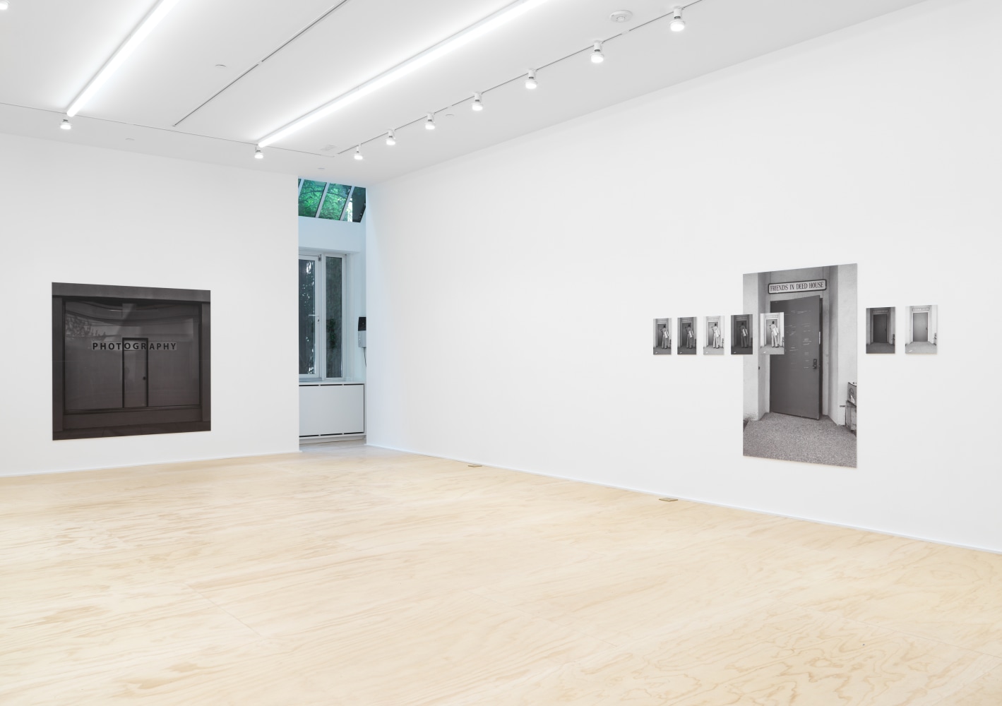 Installation view of photographs by Shannon Ebner