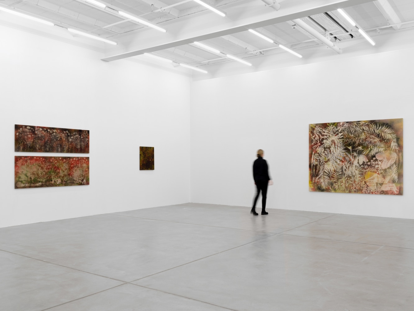 Installation view of Sam Falls paintings and ceramic reliefs exhibition