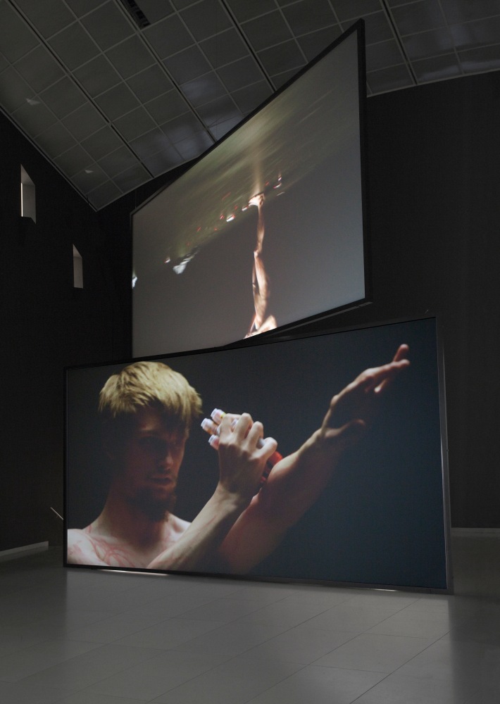 Douglas Gordon henry rebel burning and drawing 2011 HD-Video installation with sound (ratio 16:9); 2-part Sandwich screen projection (Technical equipment is not included) Edition of 3 The screen size is variable – dependent on the size of the space but has a minimum size of (2x) 281 x 500 cm / 110 5/8 x 196 7/8 in Minimum room size 700 x 1200 x 1200 cm / 275 5/8 x 472 1/2 x 472 1/2 in
