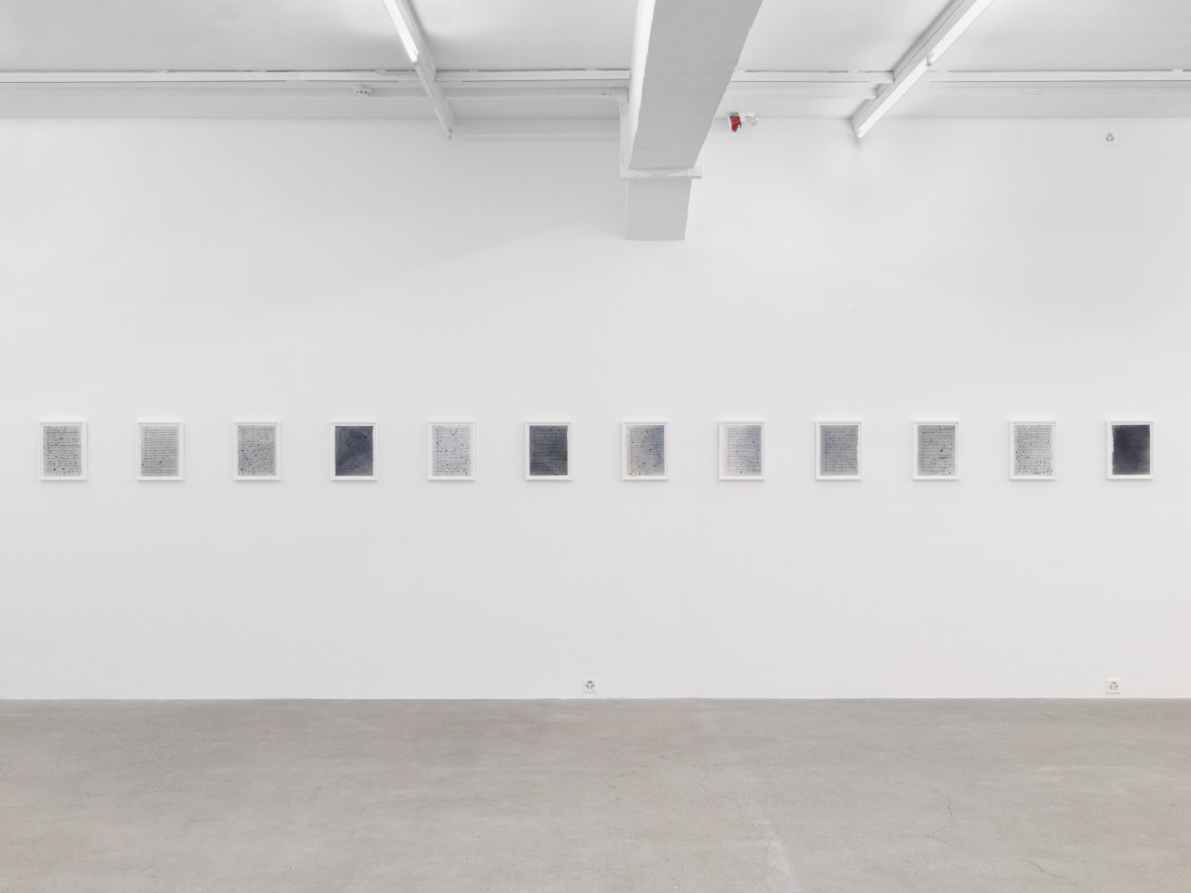 Installation view of Tim Rollins and K.O.S. paintings and text works exhibition