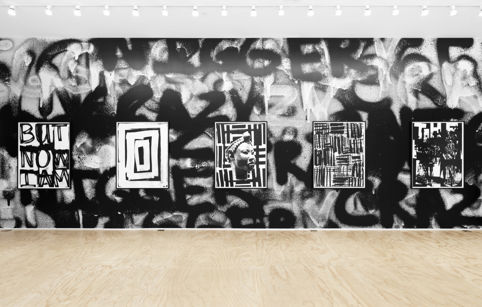 Installation view of Liam Gillick and Adam Pendleton films and wall-based works