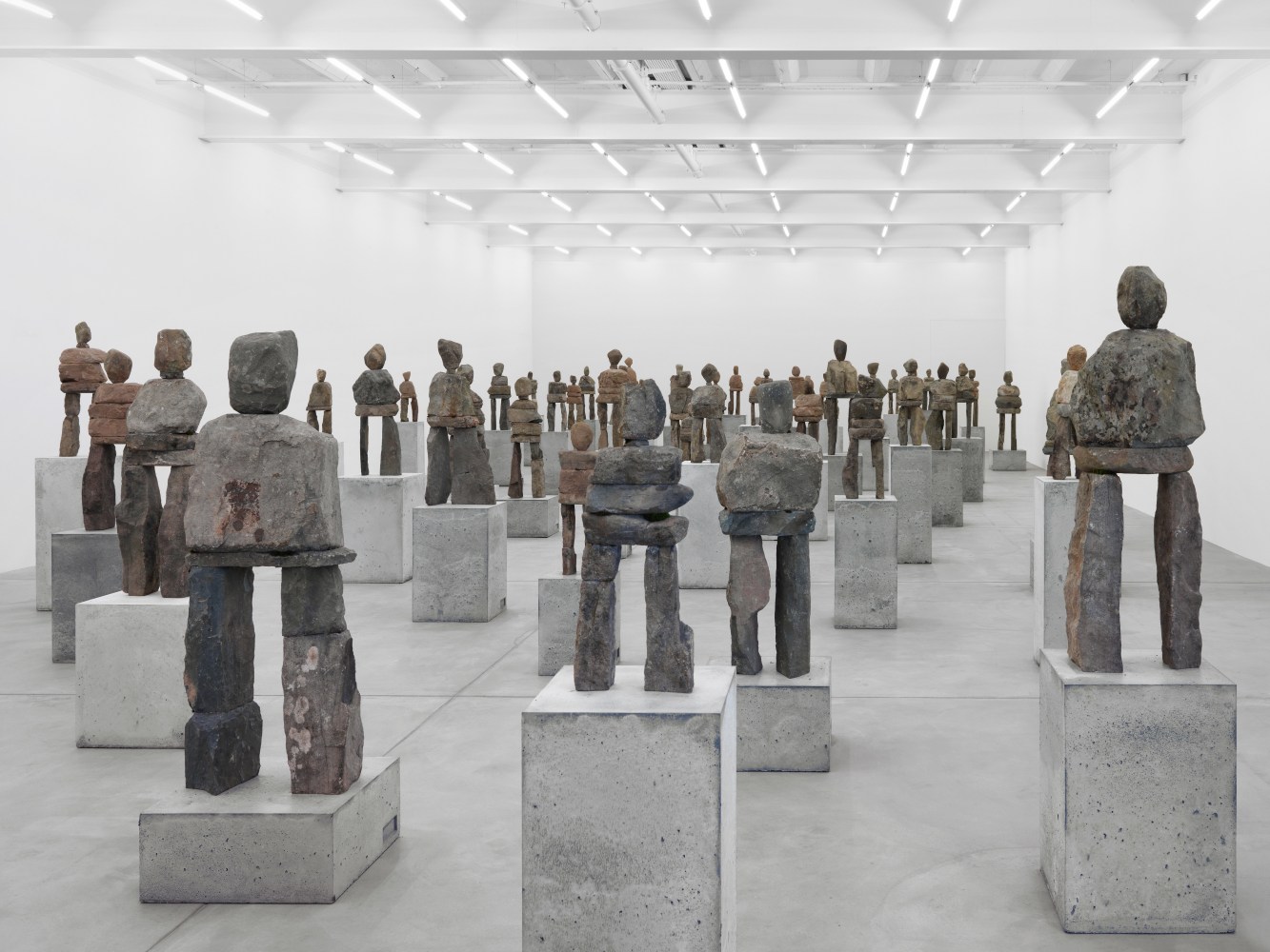 Installation view of Ugo Rondinone stone figure sculptures